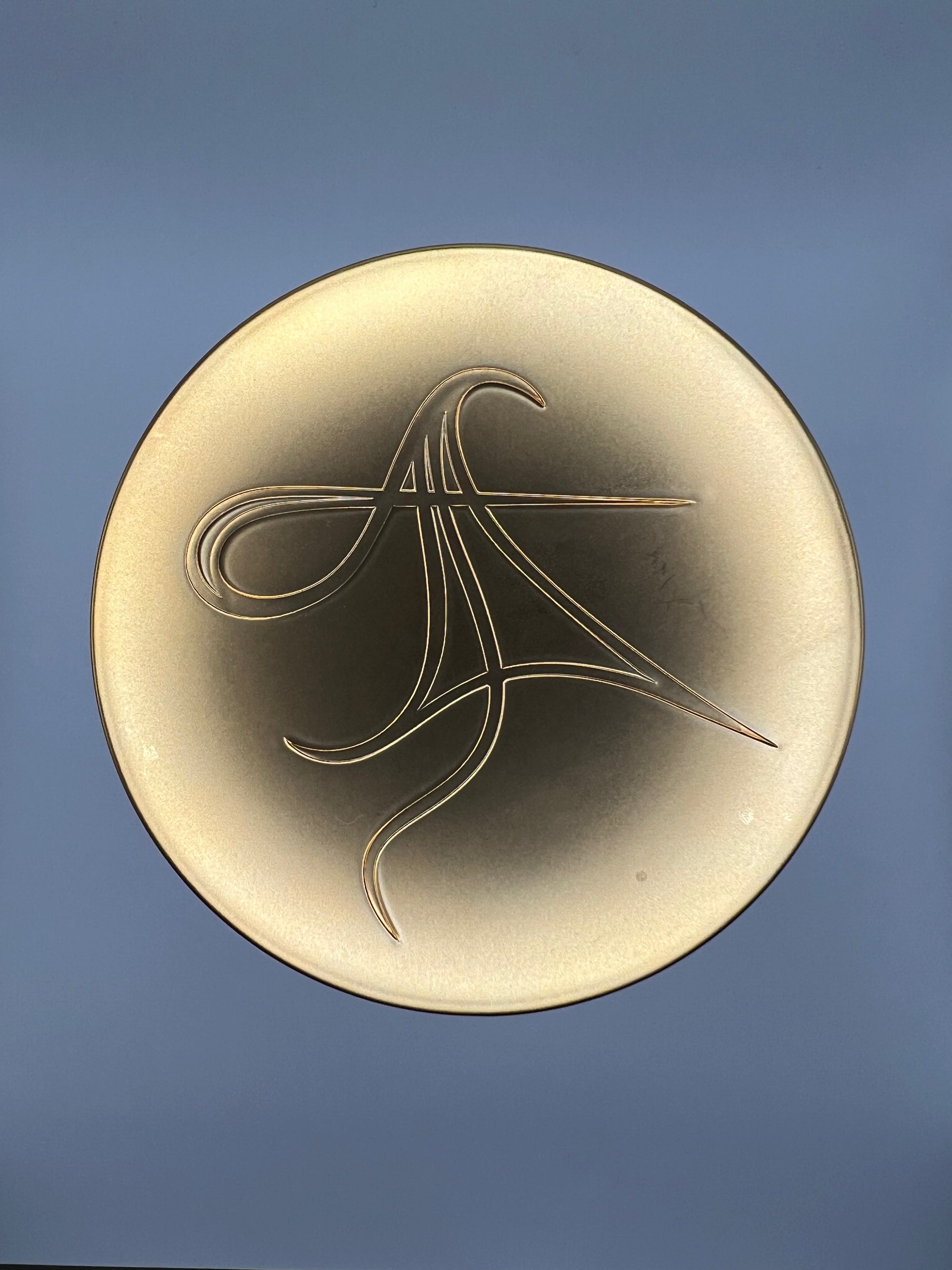 Gold lid to Livingmajik's THE SALT sore muscle bath infusion with company sigil