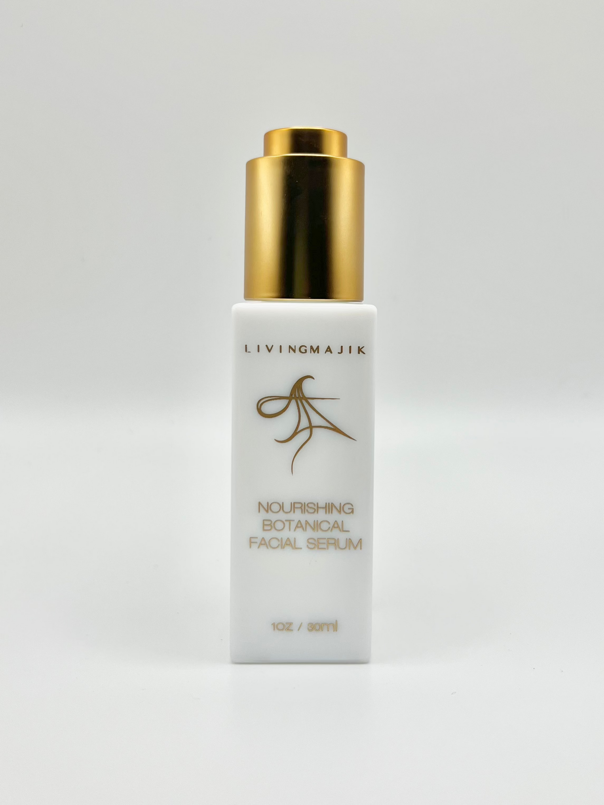 Picture of Livingmajik's Nourishing Botanical Facial Serum in a luxury white opal glass bottle with quality gold dropper