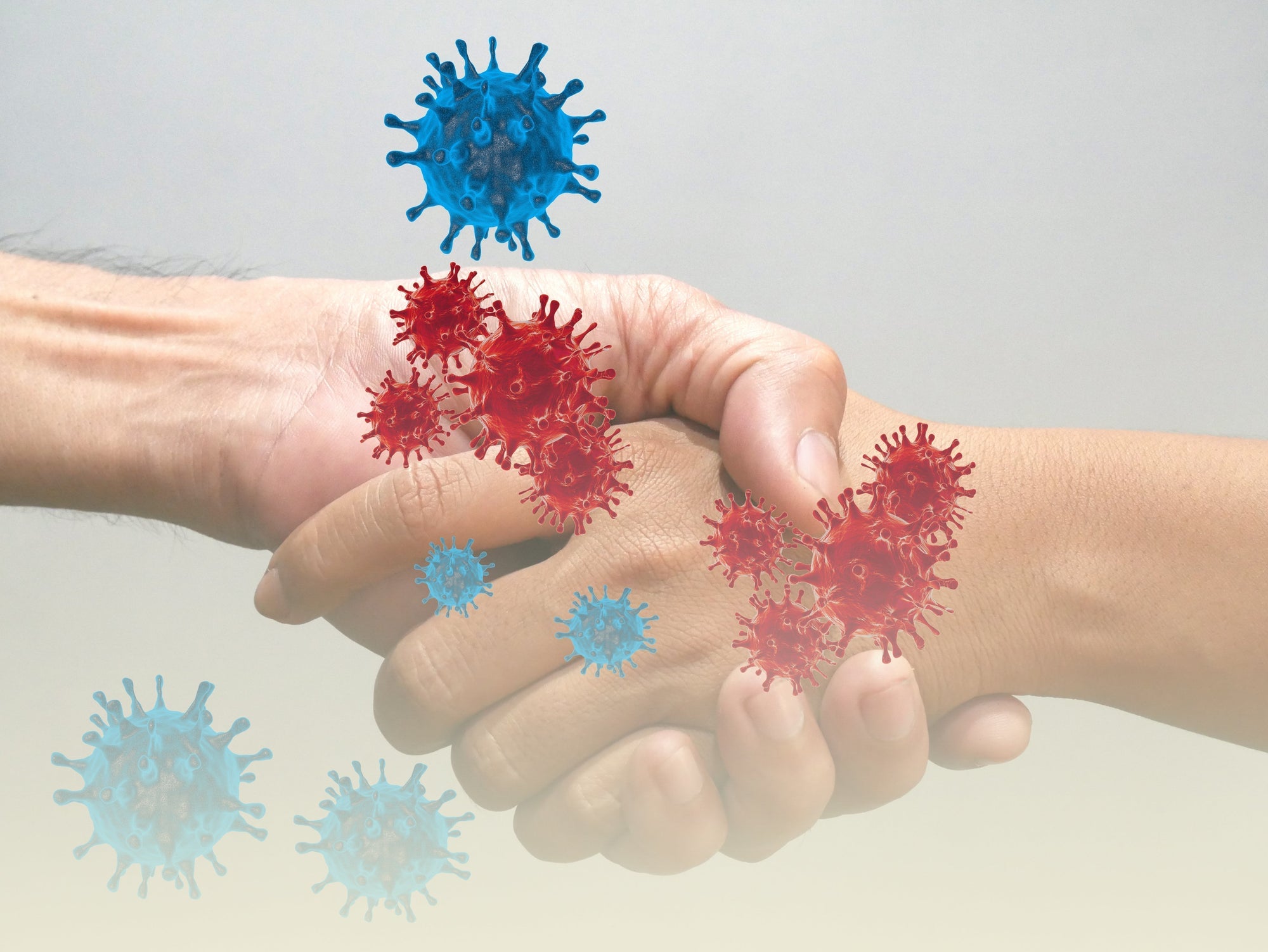A close up of two hands shaking with germs or viruses floating around contaminating each other 