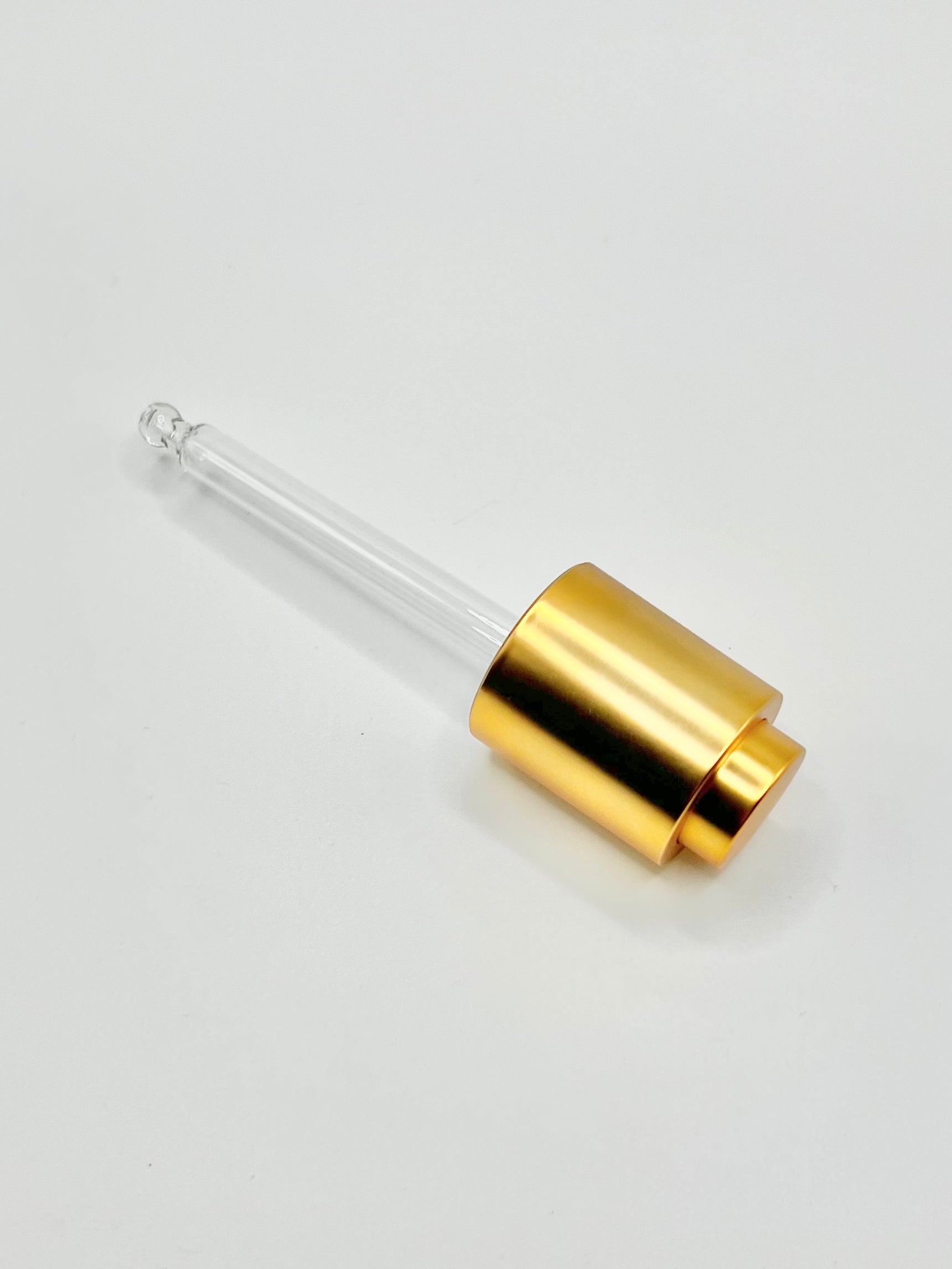 Picture of the quality, easy to use gold dropper that dispenses Livingmajik's Nourishing Botanical Facial Serum