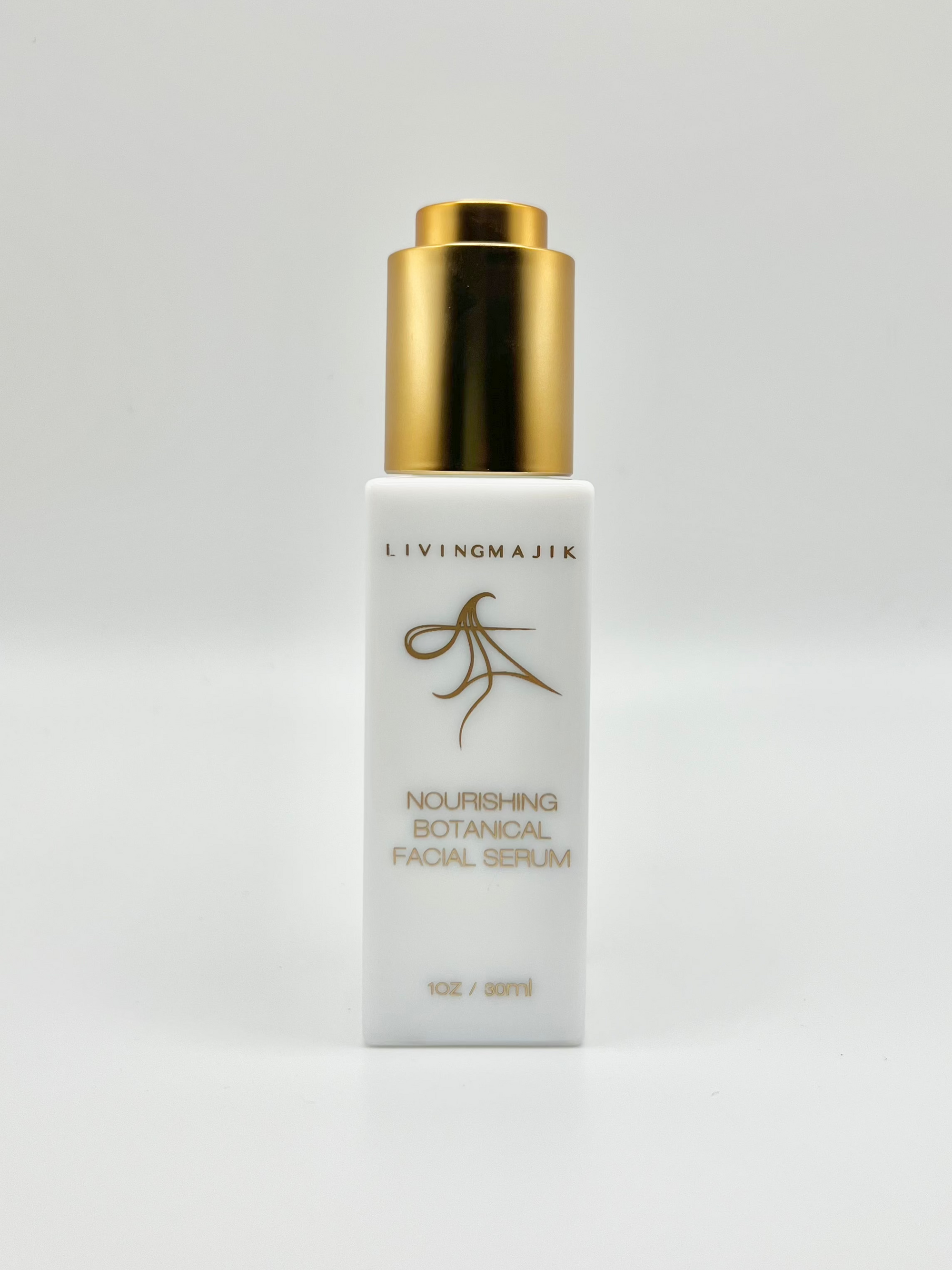 Picture of Livingmajik's Nourishing Botanical Facial Serum in a luxury white opal glass bottle with quality gold dropper 