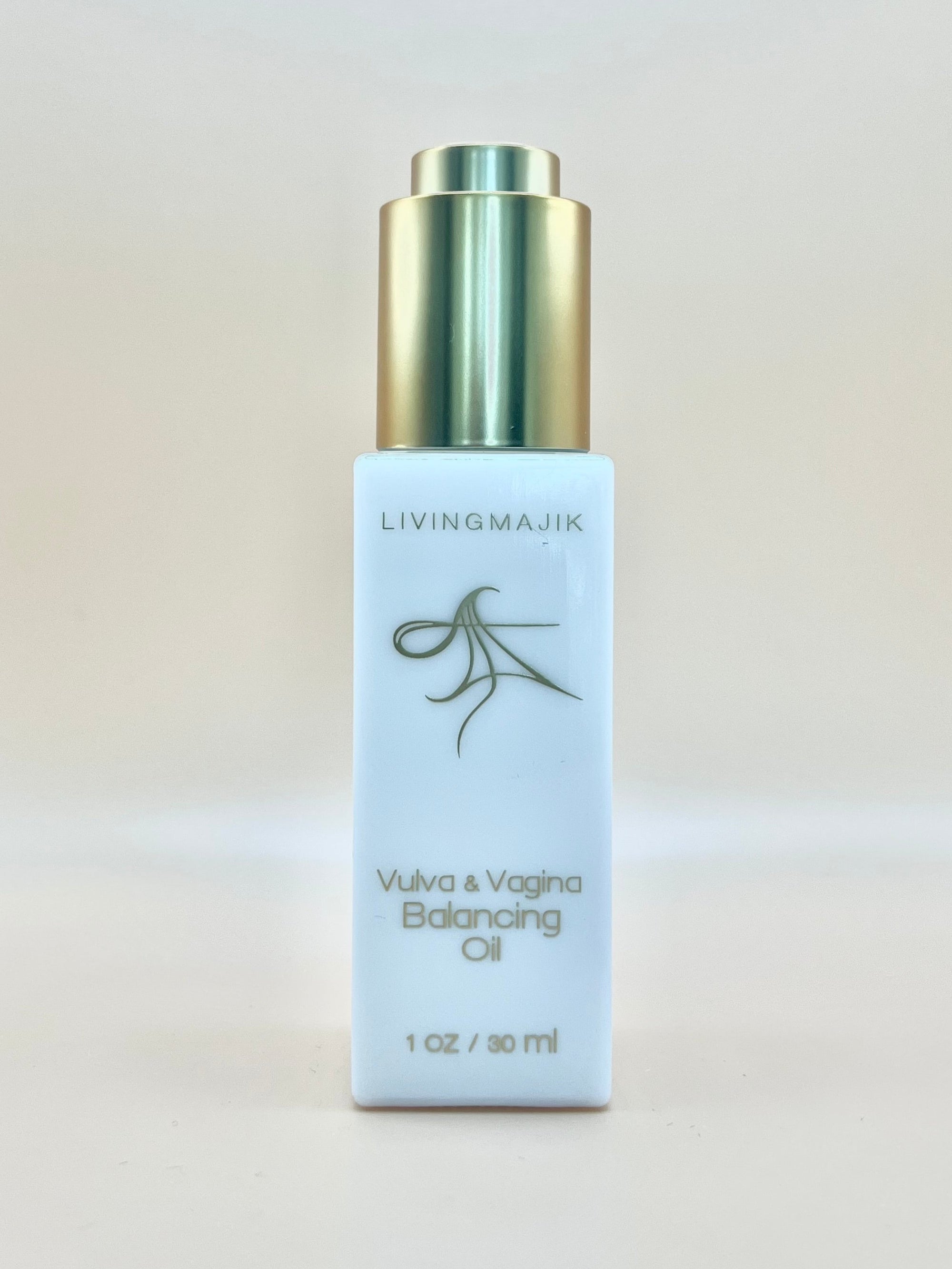 Picture of Livingmajik's Vulva and Vagina Balancing Oil in a white Opal glass bottle with gold writing. Easy to use gold dropper used to dispense the nutrient-rich all natural botanical ingredients. 